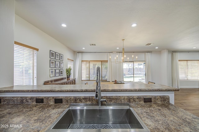 4609 E Ironhorse Rd, Gilbert, AZ 85297 - kitchen featuring a chandelier, a sink, wood finished floors, and recessed lighting