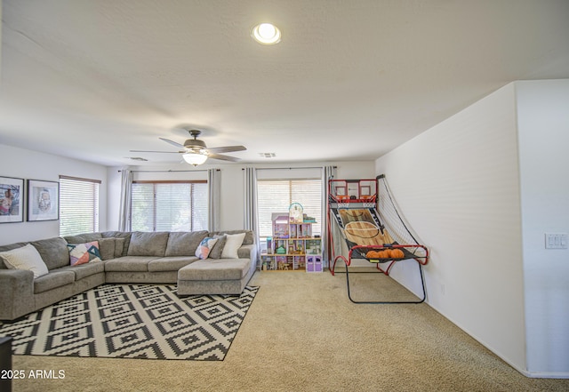 4609 E Ironhorse Rd, Gilbert, AZ 85297 - living area featuring carpet, plenty of natural light, and a ceiling fan