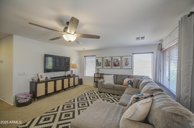 4609 E Ironhorse Rd, Gilbert, AZ 85297 - carpeted living area featuring plenty of natural light, ceiling fan, and baseboards