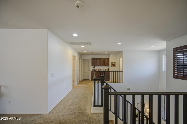 4609 E Ironhorse Rd, Gilbert, AZ 85297 - hallway with an upstairs landing, light carpet, and recessed lighting