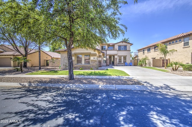 4609 E Ironhorse Rd, Gilbert, AZ 85297 - view of front of home with driveway, stucco siding, and stone siding