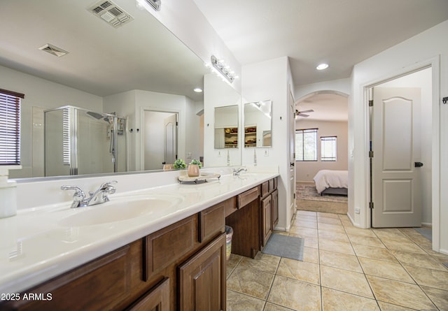 4609 E Ironhorse Rd, Gilbert, AZ 85297 - ensuite bathroom with double vanity, a shower stall, tile patterned flooring, recessed lighting, and ceiling fan