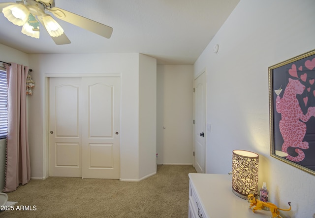 4609 E Ironhorse Rd, Gilbert, AZ 85297 - bedroom featuring light carpet, a closet, and a ceiling fan