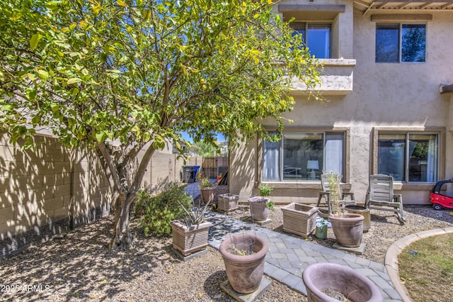 4609 E Ironhorse Rd, Gilbert, AZ 85297 - rear view of house with stucco siding, a fenced backyard, and a patio