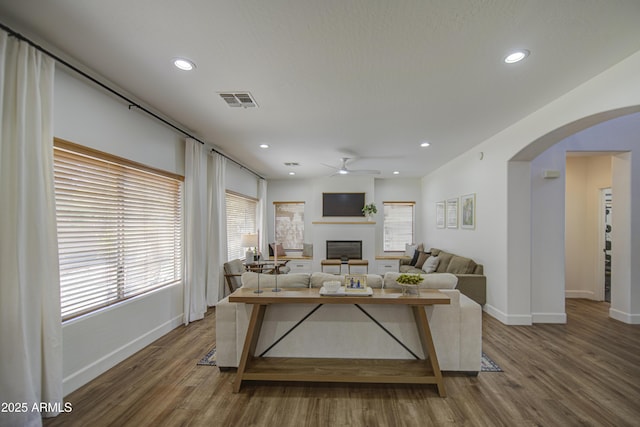 4609 E Ironhorse Rd, Gilbert, AZ 85297 - living room with a ceiling fan, arched walkways, baseboards, a fireplace, and recessed lighting
