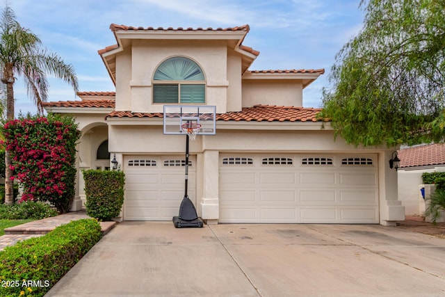 2026 E Cortez Dr, Gilbert, AZ 85234 - mediterranean / spanish home featuring driveway, an attached garage, and stucco siding