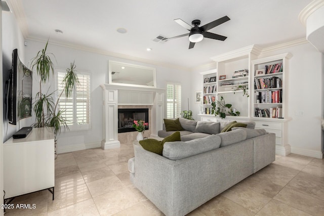 2026 E Cortez Dr, Gilbert, AZ 85234 - living area featuring ornamental molding, ceiling fan, baseboards, a tile fireplace, and light tile patterned floors