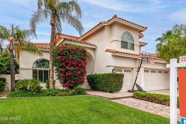 2026 E Cortez Dr, Gilbert, AZ 85234 - mediterranean / spanish house featuring driveway, stucco siding, a front lawn, a garage, and a tiled roof
