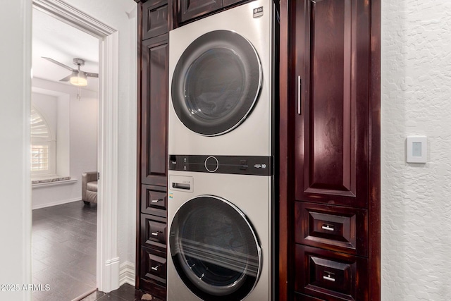 2026 E Cortez Dr, Gilbert, AZ 85234 - clothes washing area with cabinet space, stacked washer / drying machine, a textured wall, ceiling fan, and baseboards