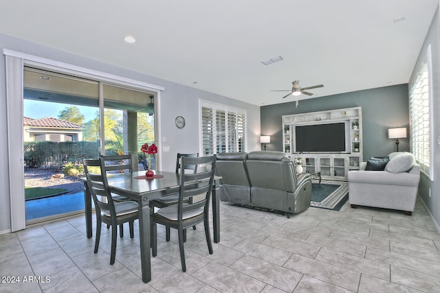 dining room with ceiling fan and light tile patterned flooring