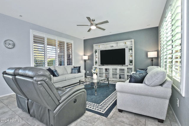 tiled living room with ceiling fan