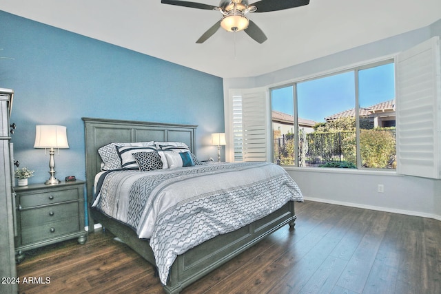 bedroom with dark hardwood / wood-style floors and ceiling fan