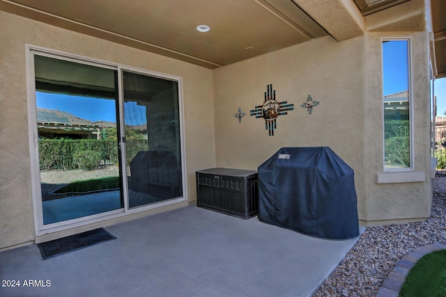 view of patio featuring a grill