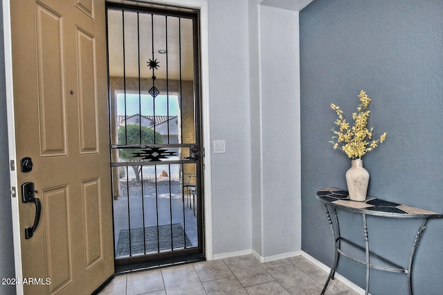 foyer entrance featuring light tile patterned floors