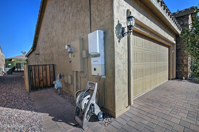 view of side of home with a garage