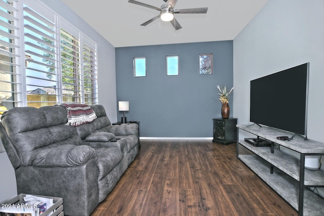 living room with ceiling fan and dark hardwood / wood-style flooring