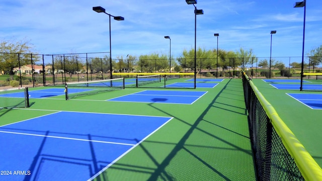 view of tennis court featuring basketball court