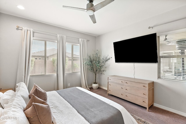 carpeted bedroom featuring a ceiling fan and baseboards