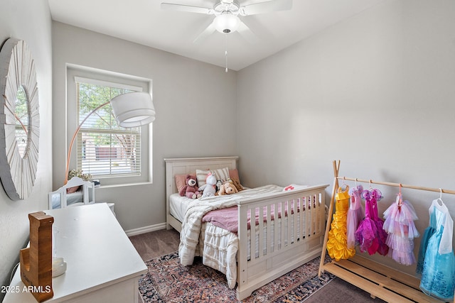 bedroom with baseboards and ceiling fan