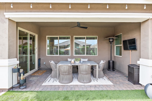 view of patio / terrace with outdoor dining area and ceiling fan