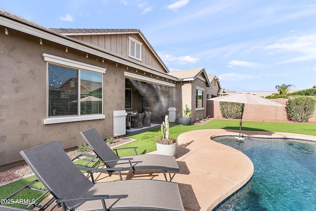 view of pool featuring a patio, a fenced backyard, and a fenced in pool
