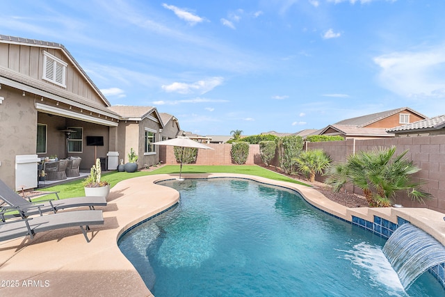 view of swimming pool featuring a fenced backyard, a fenced in pool, a lawn, and a patio area