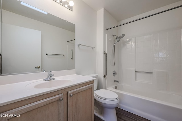 full bathroom with vanity, toilet, bathtub / shower combination, and hardwood / wood-style flooring