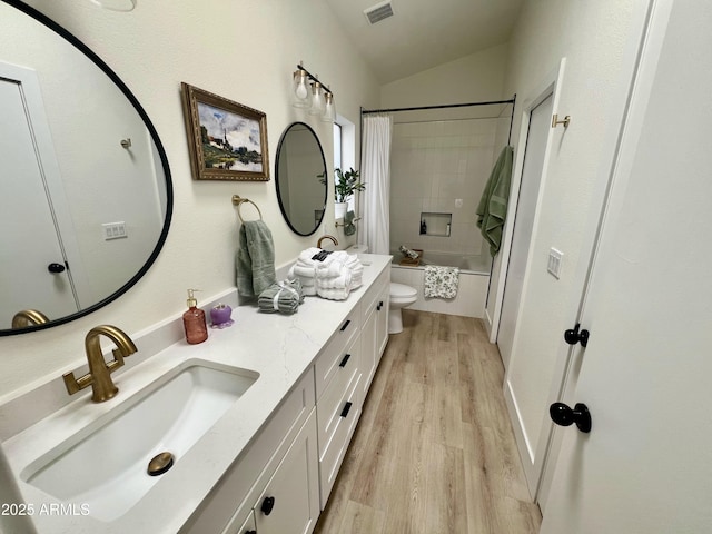 4925 W Bluefield Ave, Glendale, AZ 85308 - full bathroom featuring double vanity, wood finished floors, shower / bathtub combination with curtain, and lofted ceiling