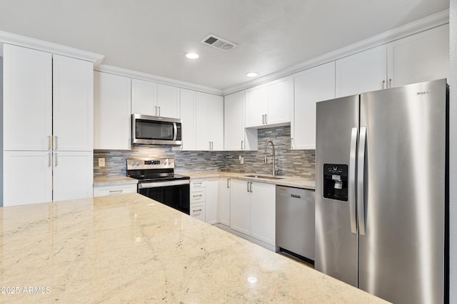 2706 W Isabella Ave, Mesa, AZ 85202 - kitchen featuring appliances with stainless steel finishes, backsplash, light stone counters, white cabinets, and recessed lighting