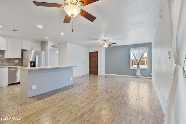 2706 W Isabella Ave, Mesa, AZ 85202 - unfurnished living room featuring a ceiling fan, light wood-style flooring, and recessed lighting