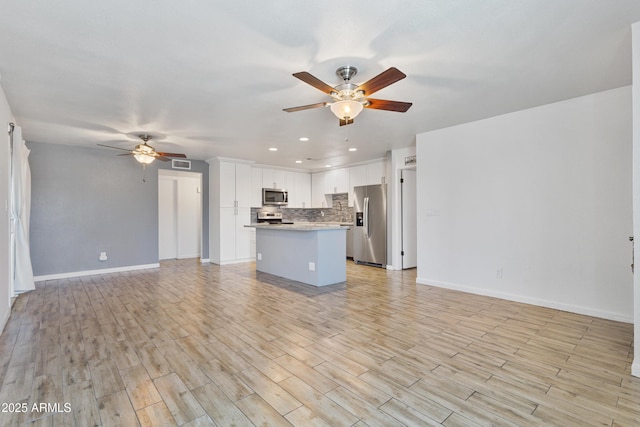 2706 W Isabella Ave, Mesa, AZ 85202 - unfurnished living room featuring a ceiling fan, recessed lighting, and light wood-type flooring