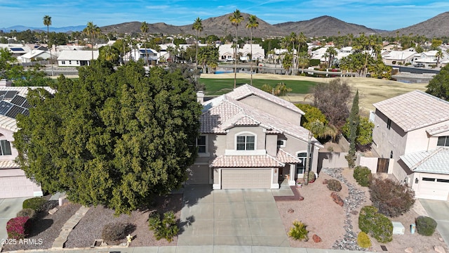 birds eye view of property featuring a mountain view