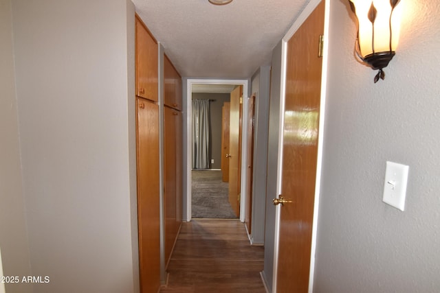 5720 E University Dr, Mesa, AZ 85205 - hallway featuring wood finished floors, a textured wall, and baseboards