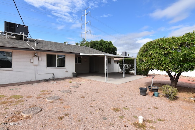 5720 E University Dr, Mesa, AZ 85205 - rear view of property with central air condition unit, a patio area, and brick siding