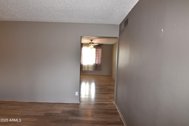 5720 E University Dr, Mesa, AZ 85205 - hall featuring wood finished floors, a textured ceiling, and baseboards