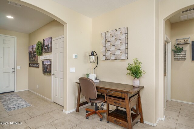 26404 W Zachary Dr, Buckeye, AZ 85396 - office featuring baseboards, visible vents, arched walkways, and recessed lighting
