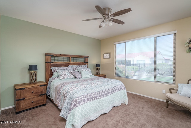 bedroom with ceiling fan and light colored carpet