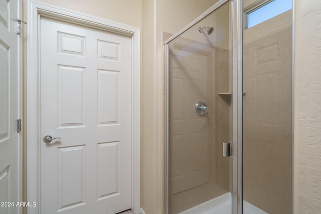 bathroom featuring an enclosed shower