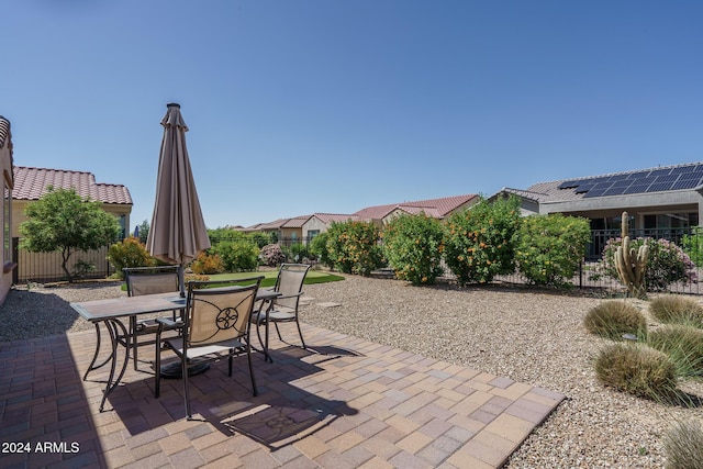 26404 W Zachary Dr, Buckeye, AZ 85396 - view of patio / terrace with fence and outdoor dining area