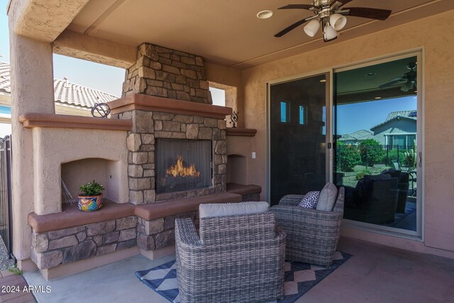26404 W Zachary Dr, Buckeye, AZ 85396 - view of patio / terrace featuring an outdoor living space with a fireplace and ceiling fan