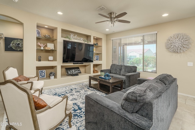 living room with light tile patterned floors, built in features, and ceiling fan