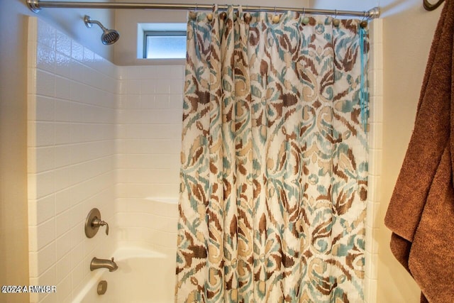 bathroom featuring shower / bathtub combination with curtain