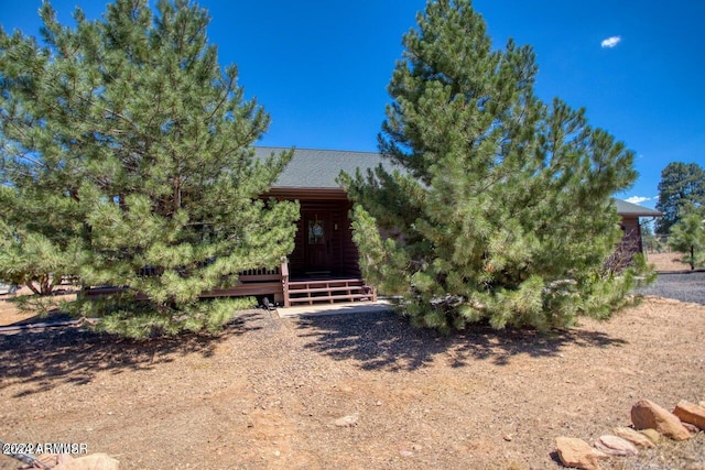 view of property hidden behind natural elements