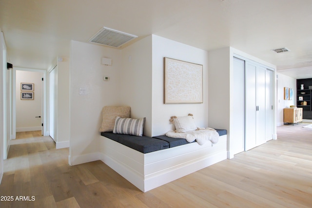 corridor featuring light hardwood / wood-style floors