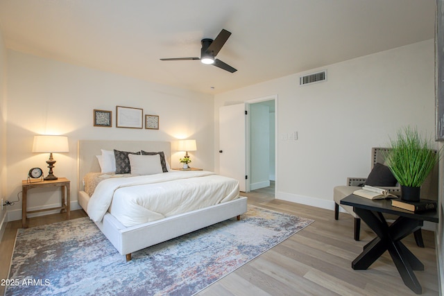 bedroom featuring hardwood / wood-style flooring and ceiling fan