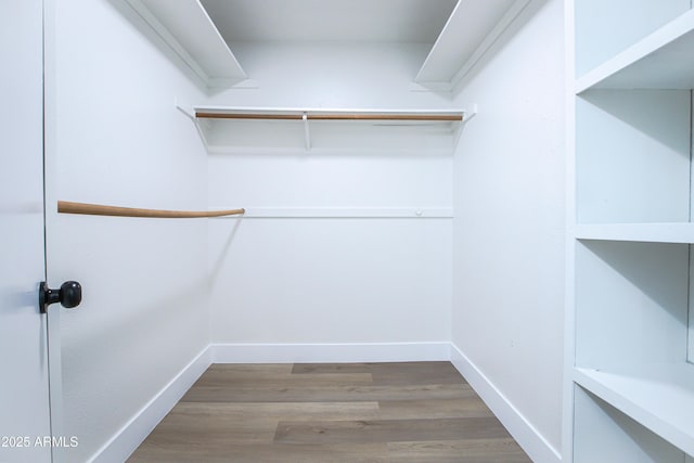 walk in closet featuring hardwood / wood-style floors