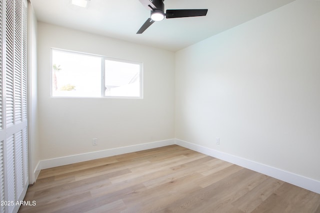 unfurnished room with ceiling fan and light wood-type flooring