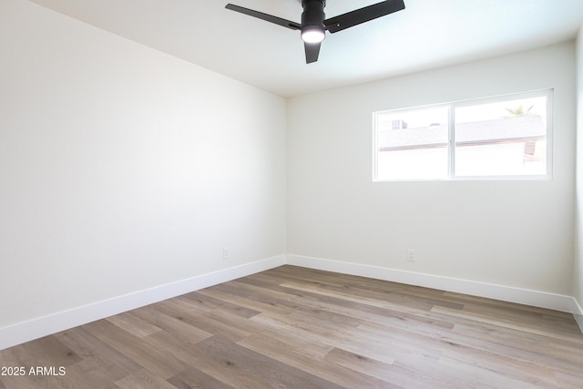 empty room featuring ceiling fan and light wood-type flooring