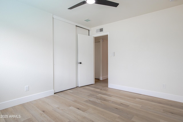 spare room featuring ceiling fan and light wood-type flooring