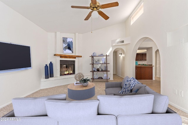 living room with carpet floors and ceiling fan